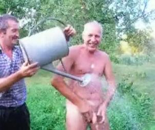 Mature parent takes douche naked outdoor