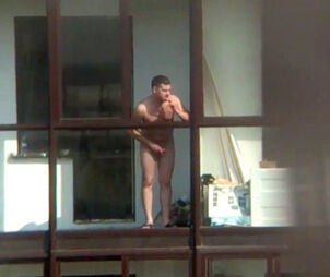 Bare boy on the balcony in spy hidden cam movie